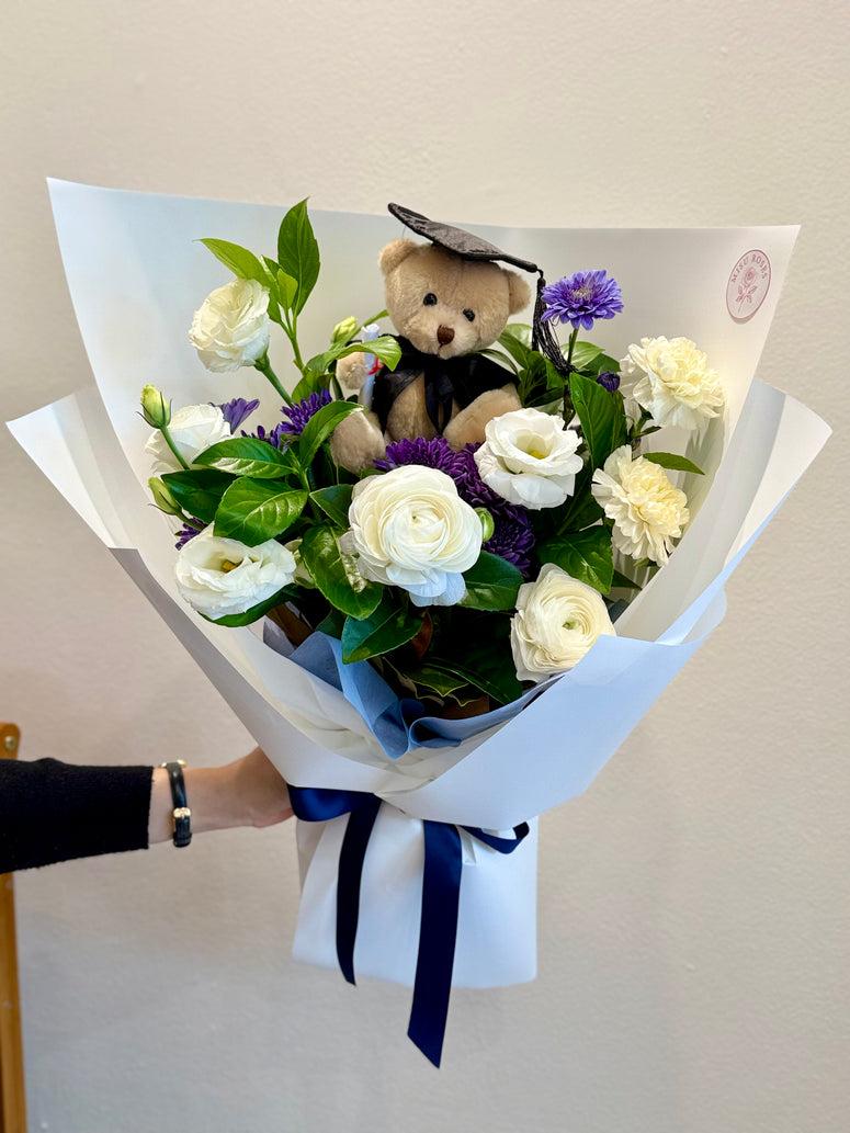 Blue and white teddy bear graduation bouquet